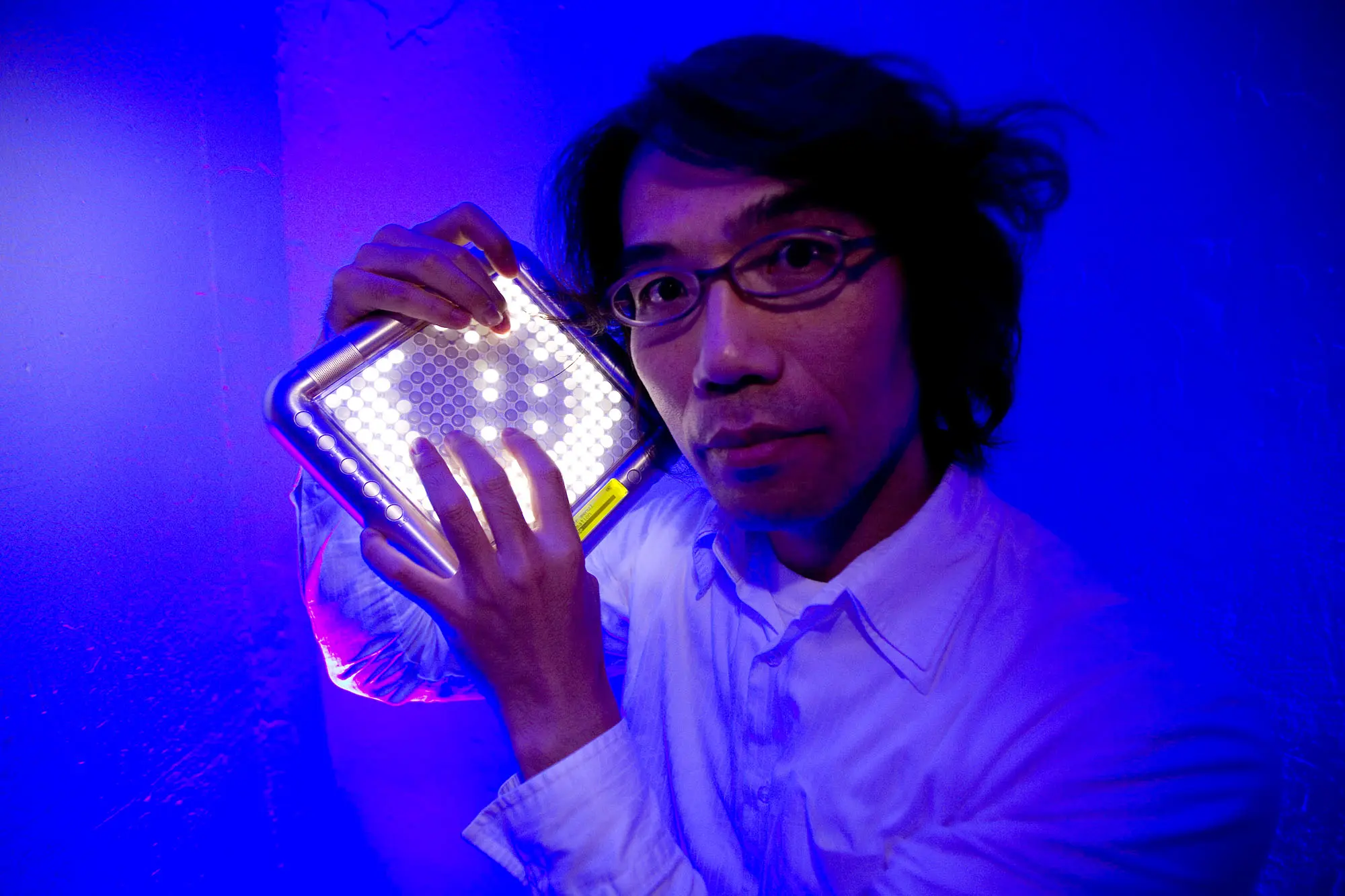 Portrait of Toshio Iwai with the Yamaha TENORI-ON